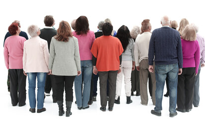 Rear view of a casual group of people looking on blank