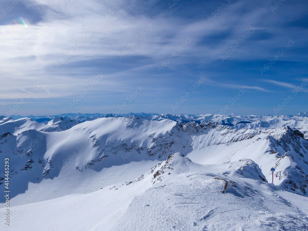 Beautiful and serene landscape of mountains covered with snow in Moelltaler Gletscher, Austria. Thick snow covers the slopes. Clear weather. Perfectly groomed slopes. Massive ski resort.