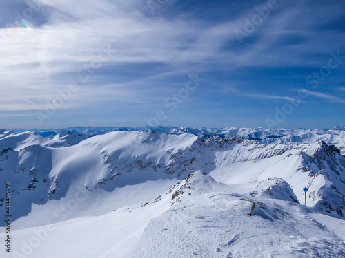 Beautiful and serene landscape of mountains covered with snow in Moelltaler Gletscher, Austria. Thick snow covers the slopes. Clear weather. Perfectly groomed slopes. Massive ski resort. © Chris