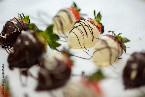 Closeup of chocolate strawberries homemade recipe, piped decoration
