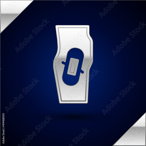 Silver Plaster on leg icon isolated on dark blue background. Vector.