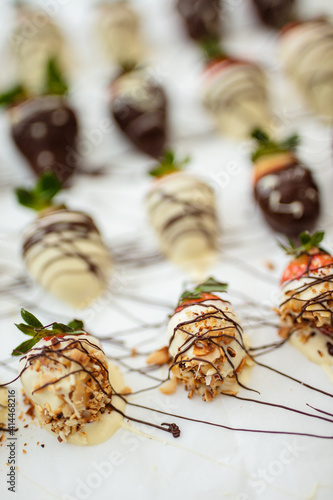 Closeup of chocolate strawberries homemade recipe, piped decoration