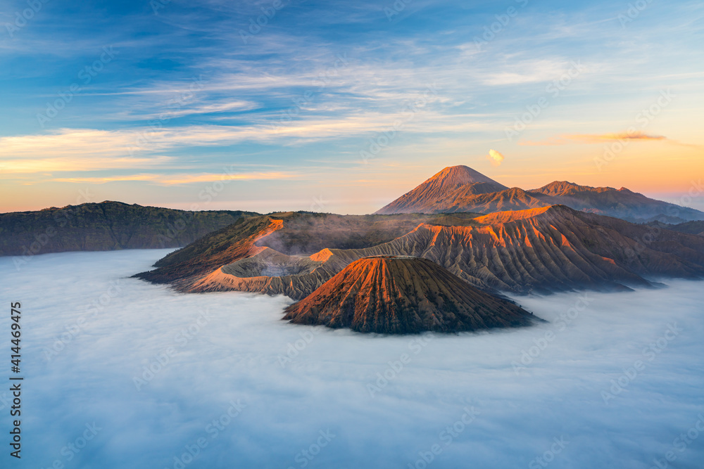 Bromo volcano mountain at sunrise in East Java, Indonesia surrounded by morning fog.