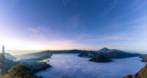 Panorama view of Mount Bromo volcano at sunrise in East Java, Indonesia surrounded by morning fog by morning fog.