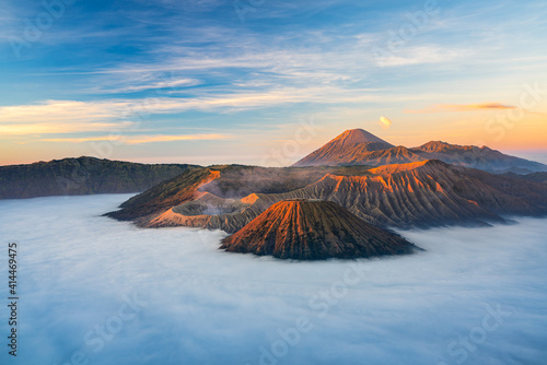 Bromo volcano mountain at sunrise in East Java, Indonesia surrounded by morning fog.