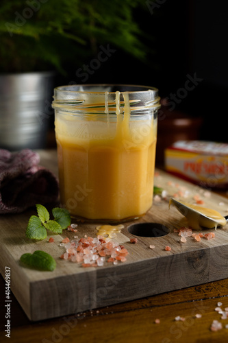 Homemade salted caramel in jam jar, butter cream sauce