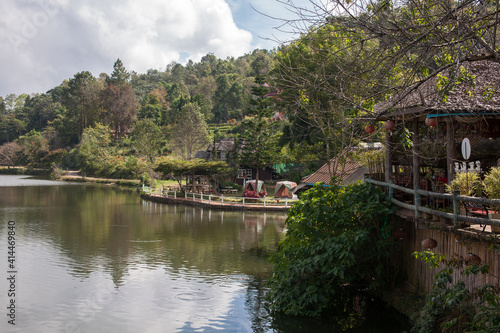 Ban Rak Thai, A highland village set in a valley surrounded by hills and tea plantations on the edge of a reservoir in Mea Hong Son Province, Thailand