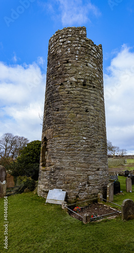 The Old Round Tower at Armoy, 7th century stone built round tower in the ancient Kingdom of Dalriada,  Causeway coast and Glens , Armoy, County Antrim, Northern Ireland photo