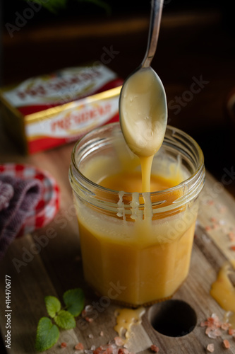 Homemade salted caramel in jam jar, butter cream sauce