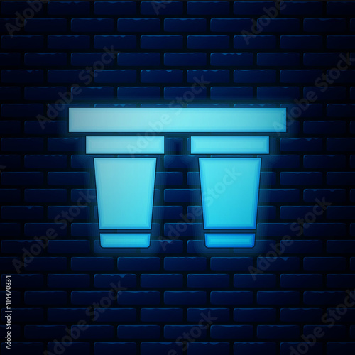 Glowing neon Water filter icon isolated on brick wall background. System for filtration of water. Reverse osmosis system. Vector.