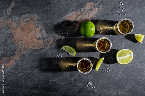 Mexican tequila with lime and salt on rustic black background. space for text. luxury drink. Alcoholic drink concept. Mexican national drink
