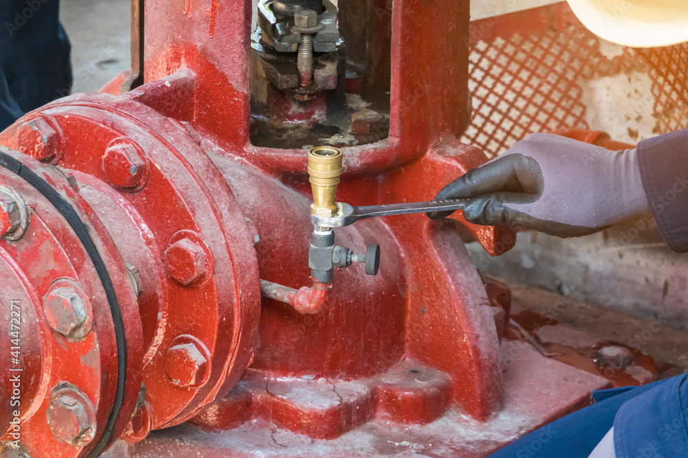 maintenance man check height temperature of motor fire pump in the