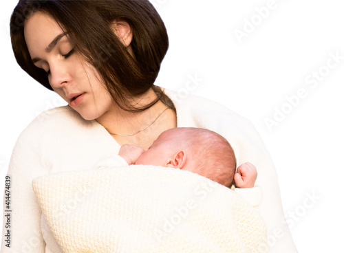 young mother tired falling asleep with newborn baby sleeping on her hands. isolated on white