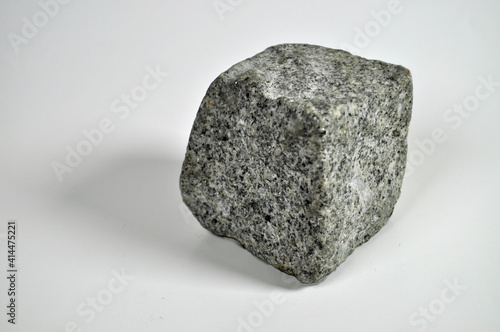 Granite paving stone against white background