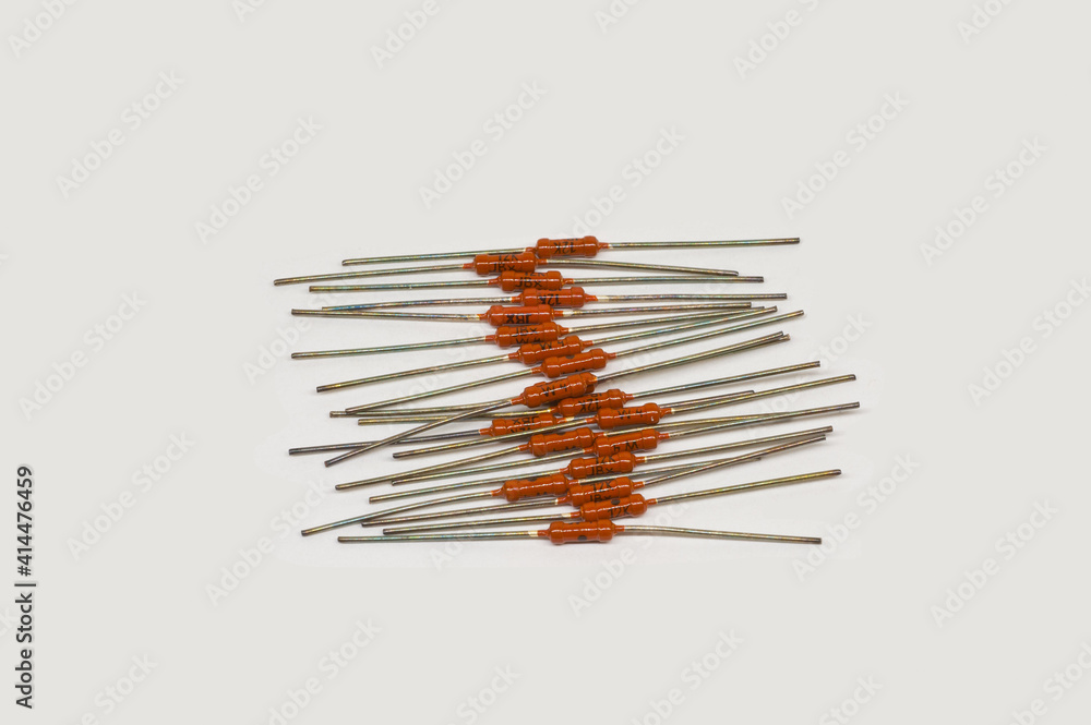 Resistors MLT 0.125 W. 12 kOhm. on white paper. Resistors MLT 0.125 W. 12 kOhm. on white paper.