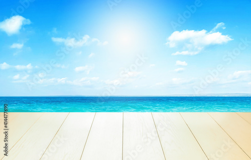 Beautiful beach with white sand in sunny summer day. Turquoise ocean water and blue sky with clouds . Natural background for summer vacation, soft focus, space for text