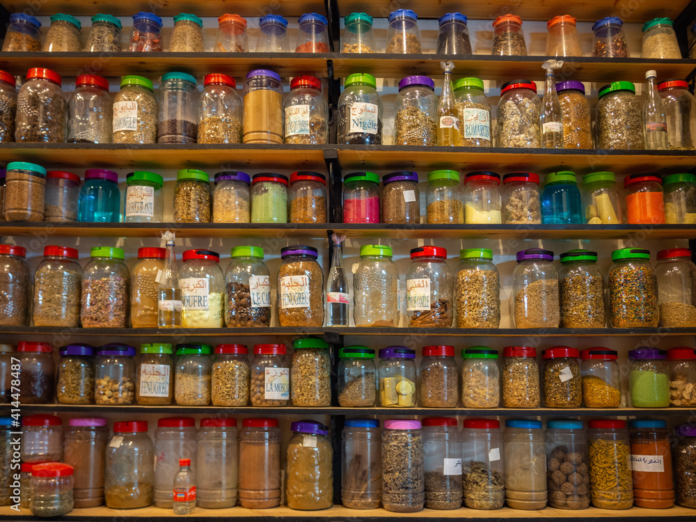 Colorful pattern of jars on shelves in a store in Meknes, Morocco.