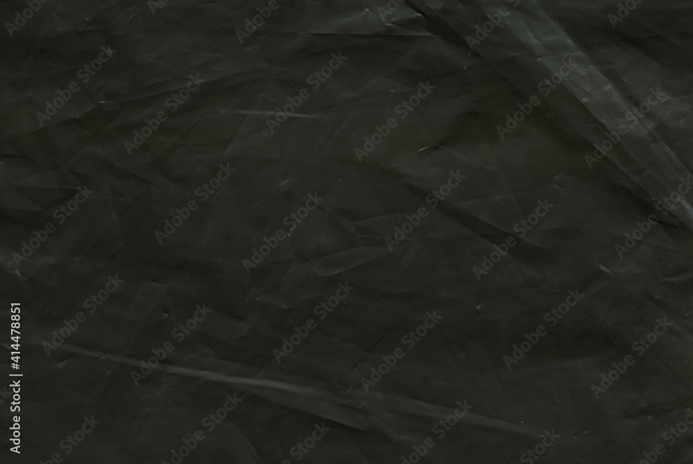 texture of black matte polyethylene background - obrazy, fototapety, plakaty 