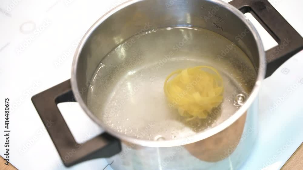 The pasta is cooked in boiling water in a saucepan The pasta is cooked in boiling water in a saucepan
