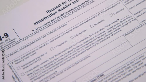 Wallpaper Mural A caucasian woman's hand fills out Tax Form W9 for the IRS. (Camera Used: Canon C300) Torontodigital.ca