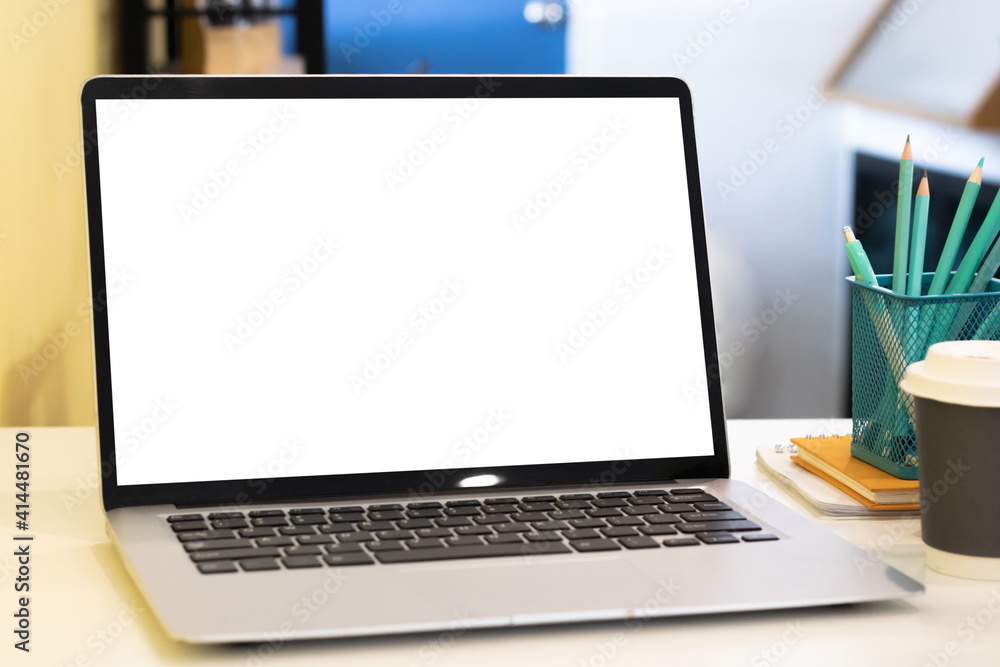 Laptop computer with mockup or blank screen on white desk in workspace and copy space concept Laptop computer with mockup or blank screen on white desk in workspace and copy space concept