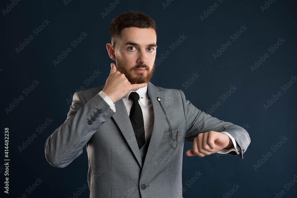 Upset young entrepreneur saying that it's time to call me Upset young entrepreneur saying that it's time to call me