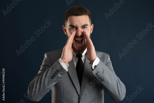 Young businessman shouting at you © Catalin Pop