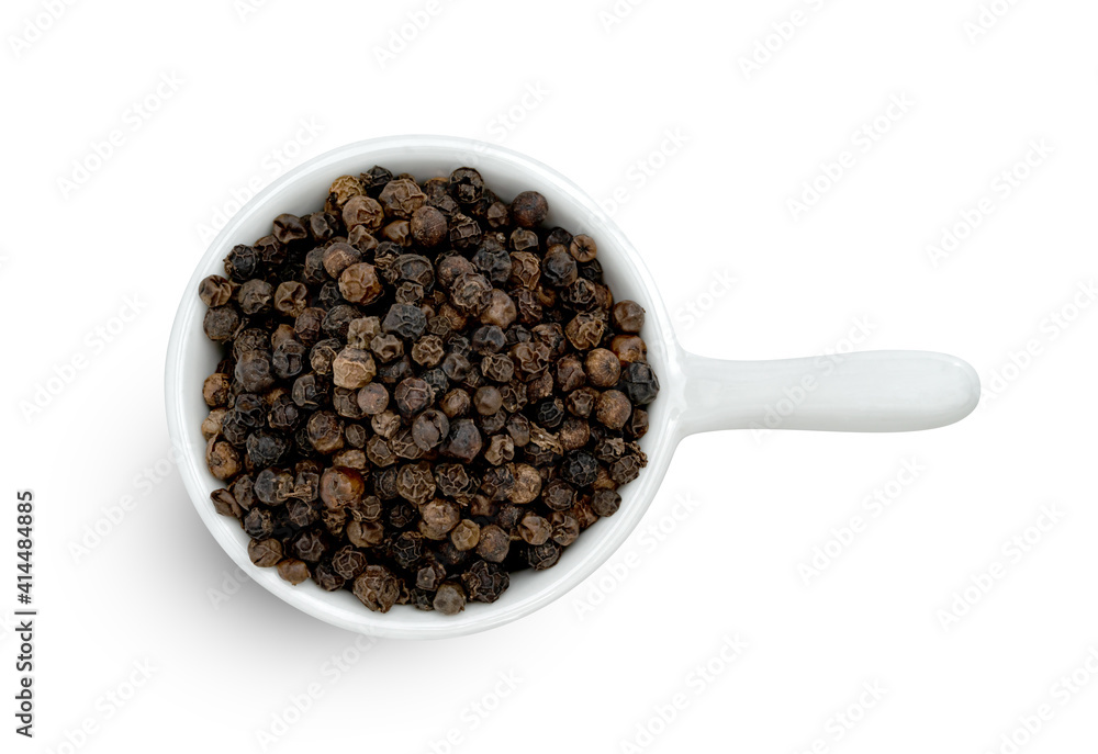 Black pepper pile or Black peppercorns seeds in ceramic bowl isolated on white background. Black pepper pile or Black peppercorns seeds in ceramic bowl isolated on white background.