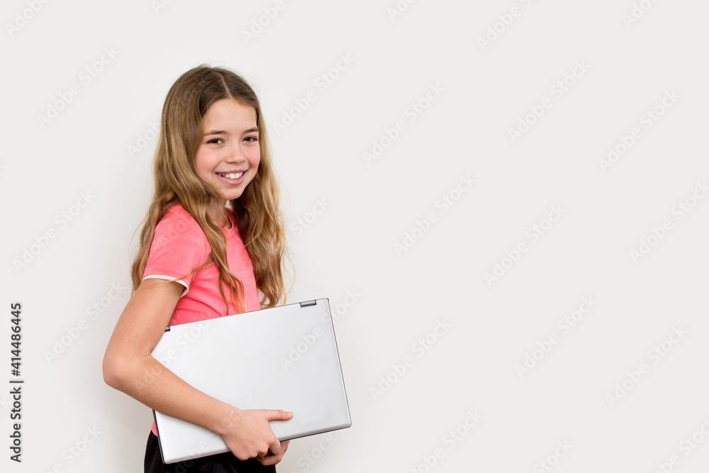Young girl with laptop isolated on white background. Technology, communication and education concept. Young girl with laptop isolated on white background. Technology, communication and education concept.