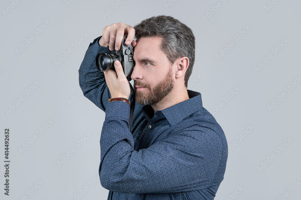 Worth capturing. Bearded man take photo with camera. Shooting session. Photography session Worth capturing. Bearded man take photo with camera. Shooting session. Photography session