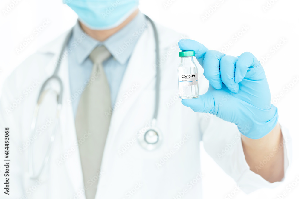 Development and creation of a coronavirus vaccine COVID-19 .Coronavirus Vaccine concept in hand of doctor blue vaccine jar. Vaccine Concept Development and creation of a coronavirus vaccine COVID-19 .Coronavirus Vaccine concept in hand of doctor blue vaccine jar. Vaccine Concept