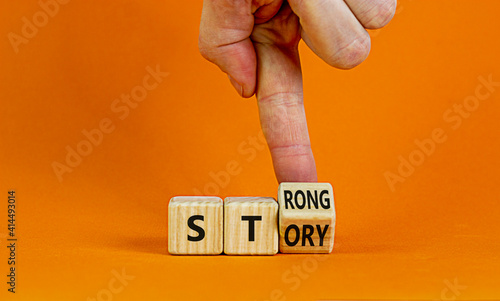 Strong story symbol. Businessman turns wooden cubes with words 'strong story'. Beautiful orange background, copy space. Business and strong story concept. photo