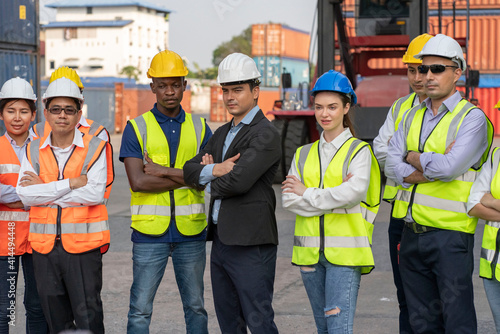 Fotografija The supervisor and the work team embraced the success of the container yard
