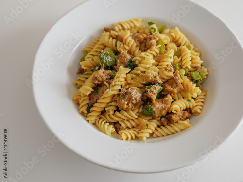 Pasta with Meatball, Green Pepper, Parsley and Provolone Cheese in a Flat White Bowl