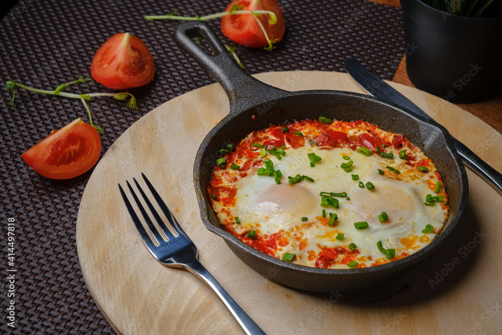 Omelet with tamat in a pan Omelet with tamat in a pan