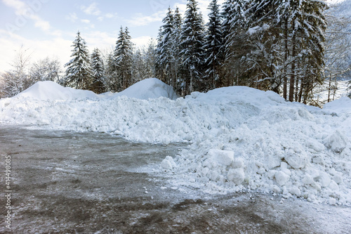 фотографія Big piles of snow from plowing on a road.