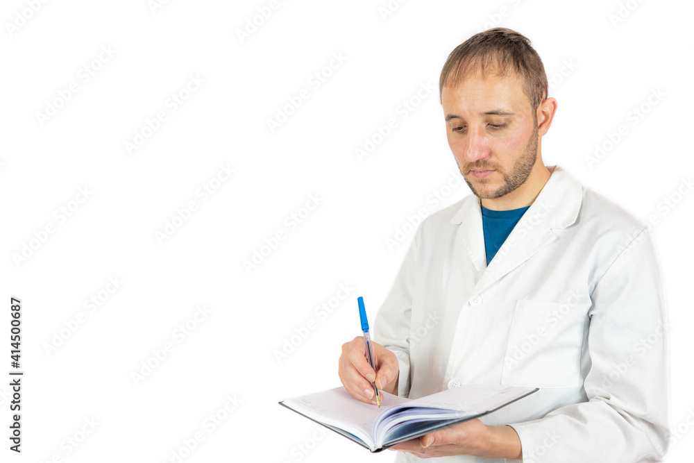 Male doctor taking notes isolated on a white background Male doctor taking notes isolated on a white background