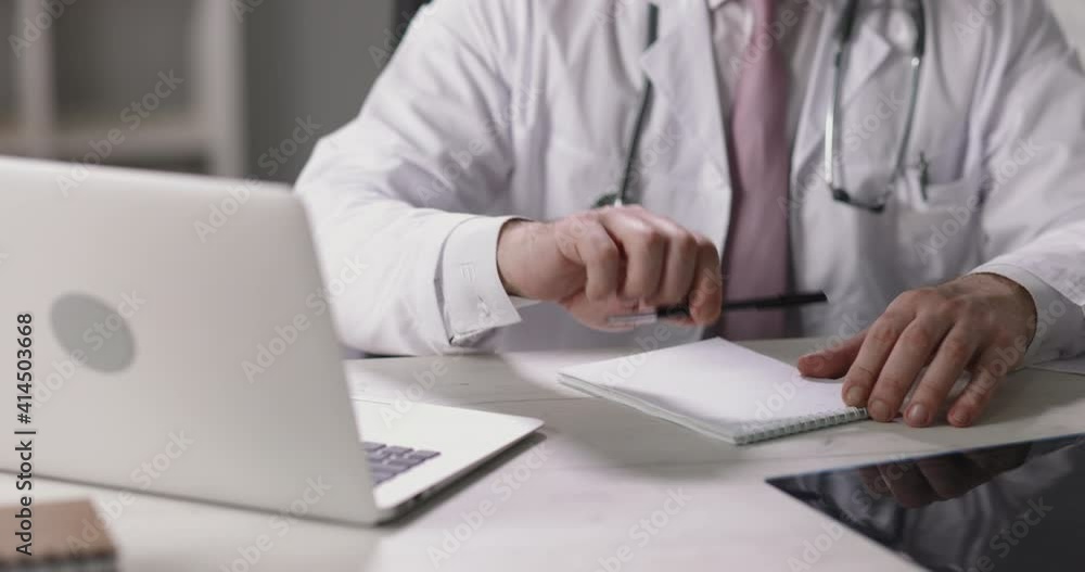 Practitioner doctor looking at laptop screen and giving consultations in video chat. Healthcare worker using technology to communicate with patients 4k footage Practitioner doctor looking at laptop screen and giving consultations in video chat. Healthcare worker using technology to communicate with patients 4k footage