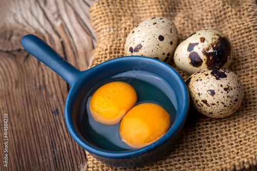 quail eggs on the wooden ba...