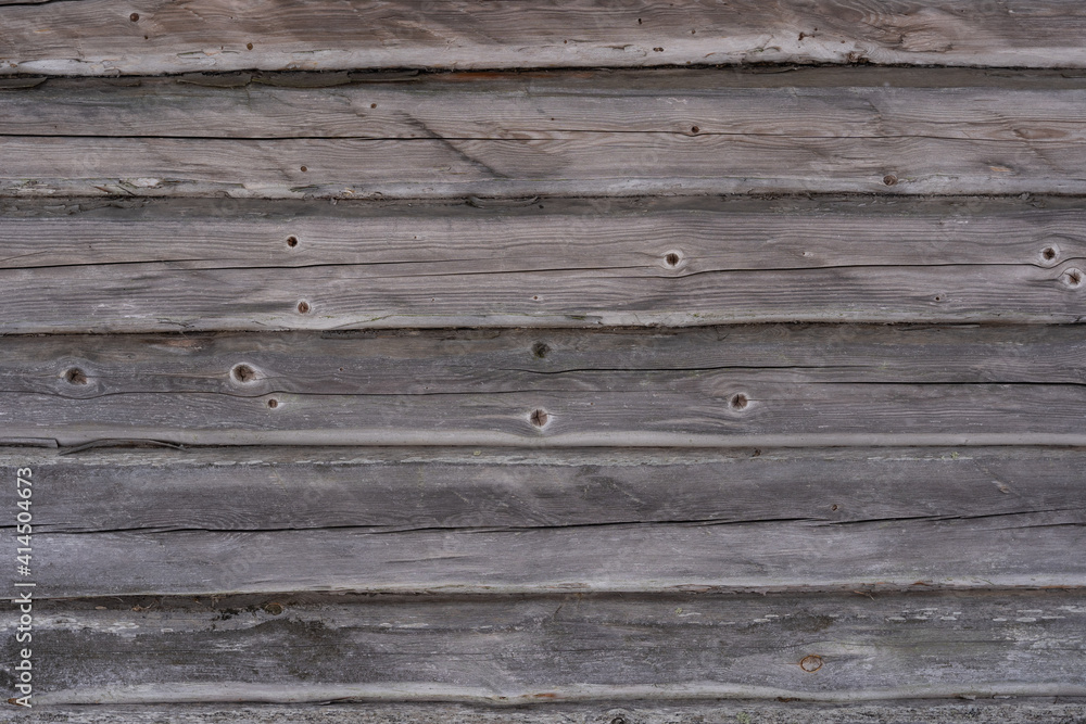 close up of an old wooden log building with gray old logs close up of an old wooden log building with gray old logs