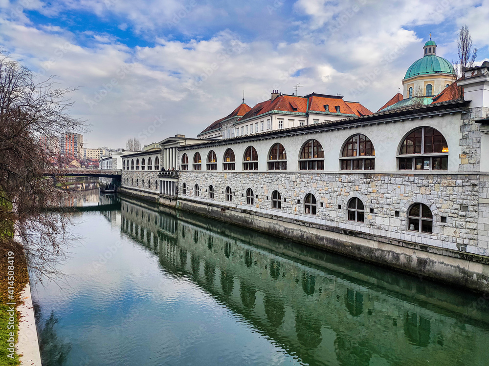 Reflections of the old market in the river