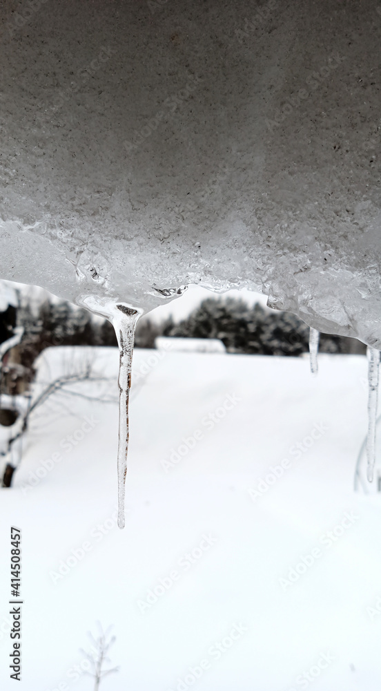 An icicle hanging from the edge of the roof. An icicle hanging from the edge of the roof.