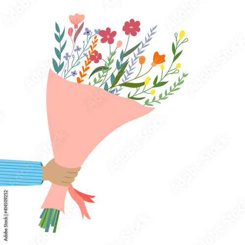 Hand holds bouquet of flowers. Bouquet of flowers for the holiday. Congratulations to the woman. Spring holiday gift for a woman. Romantic design with a bouquet of flowers.