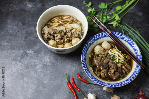 Thai boat noodles is Thailand's most famous noodles soup,Thai Boat noodles soup or Guay tiew reua ,Rice noodles thicken soup with stewed pork and pork ball, Braised pork and liver pork,  photo