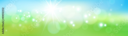 Abstract defocused nature background with blue and green blurred bokeh circles. Summer sun with light rays. Eps10