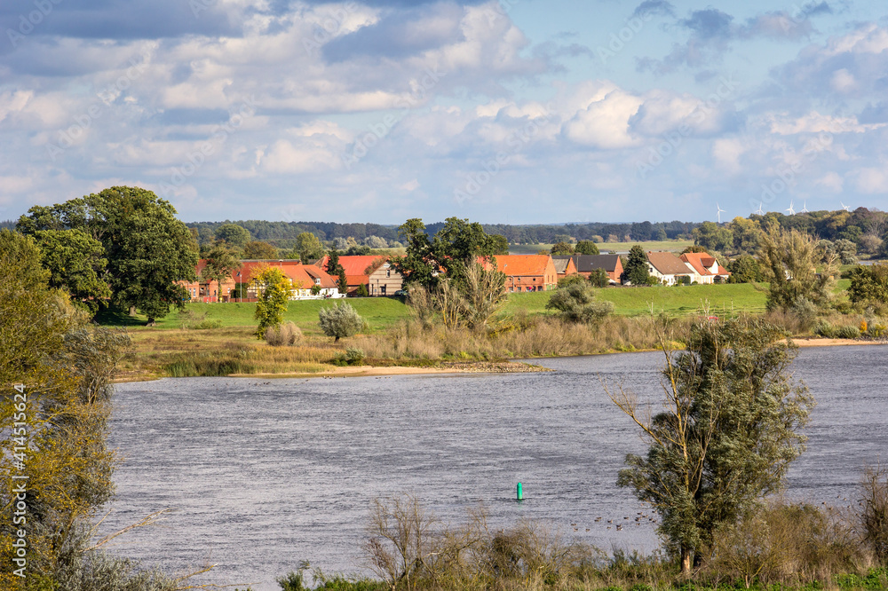 View of a small village directly behind the dyke of the river Elbe.