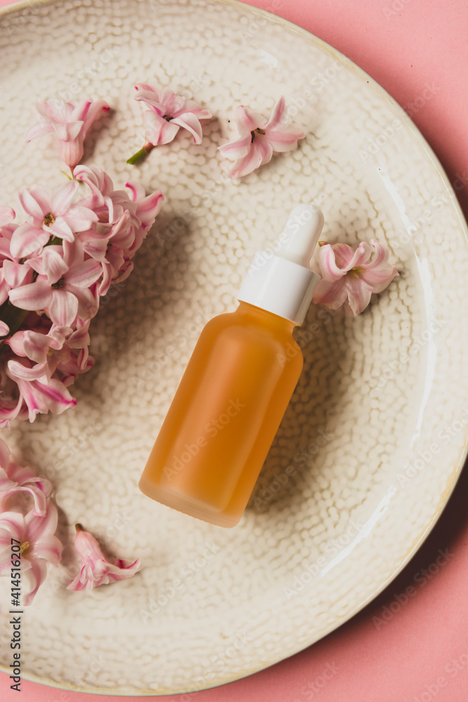 Essence oil orange mate pipette bottle, vitamin c serum, beauty cosmetics, aroma therapy. Pink background Essence oil orange mate pipette bottle, vitamin c serum, beauty cosmetics, aroma therapy. Pink background