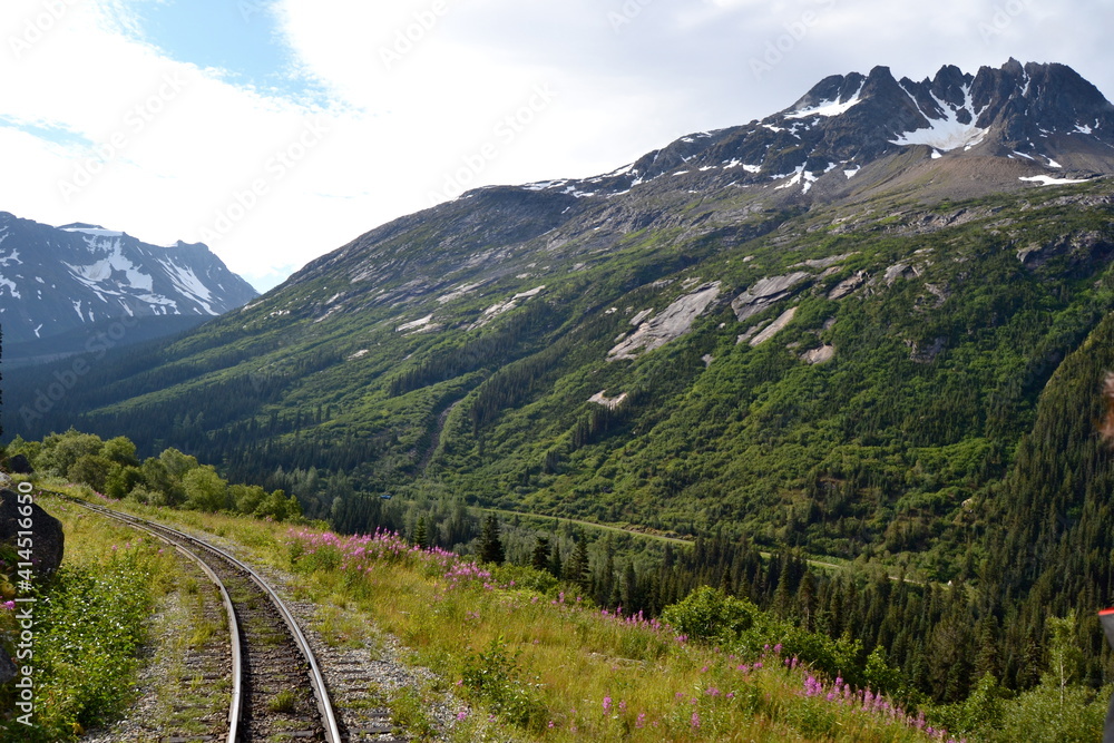 The White Pass historic train tracks passing over mountains from Skagway Alaska to Fraser BC on the route of the Klondike Gold miners