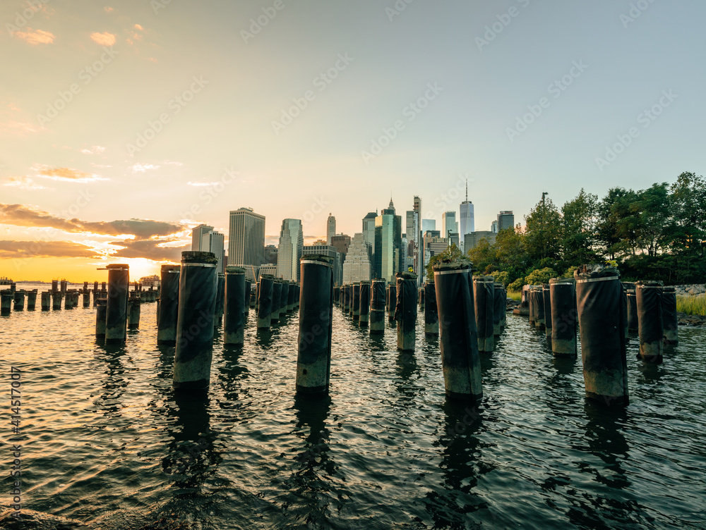 reflections sun pier panorama views city new york buildings skyscrapers beautiful sunset water sea 