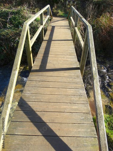 Fototapeta Naklejka Na Ścianę i Meble -  Trekking in Nature Park over bridge
